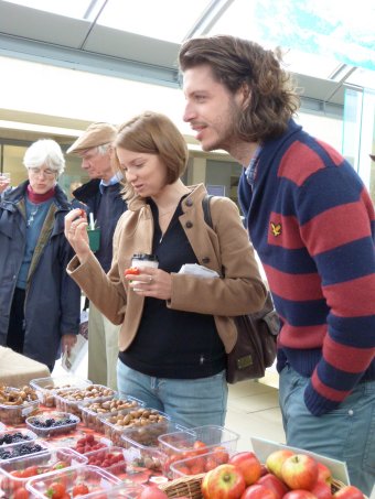 This young couple are interested in the Stawberries on display.